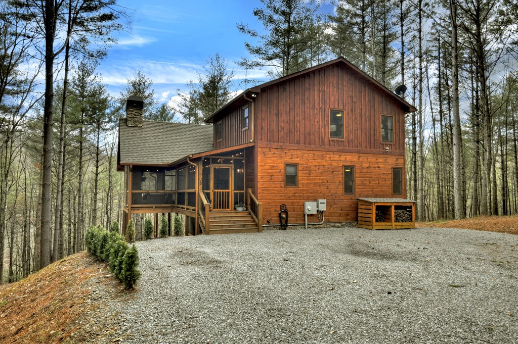 705 George Curtis Road Blue Ridge, GA 30513 - Photo 5 of 49 a view of a house with backyard and sitting area