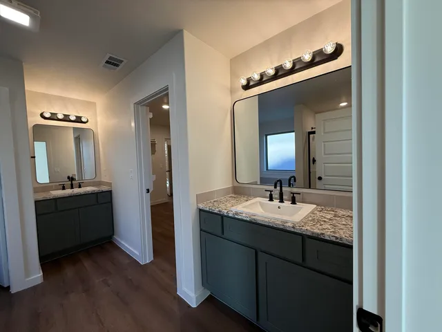 a bathroom with a tub and shower