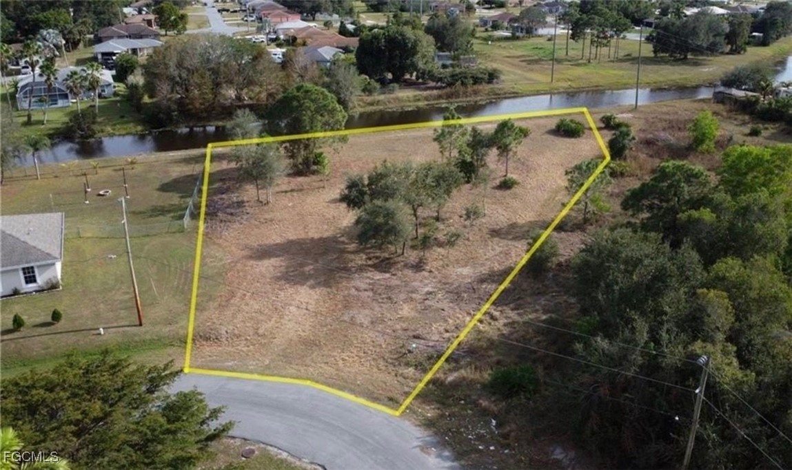 145 Zenith Circle Fort Myers, FL 33913 - Photo 2 of 9 a view of a lake with a yard