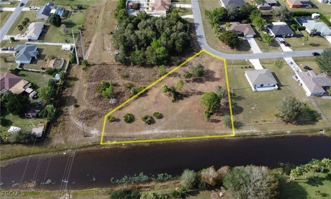 145 Zenith Circle Fort Myers, FL 33913 - Photo 5 of 9 an aerial view of a house with a yard and lake view