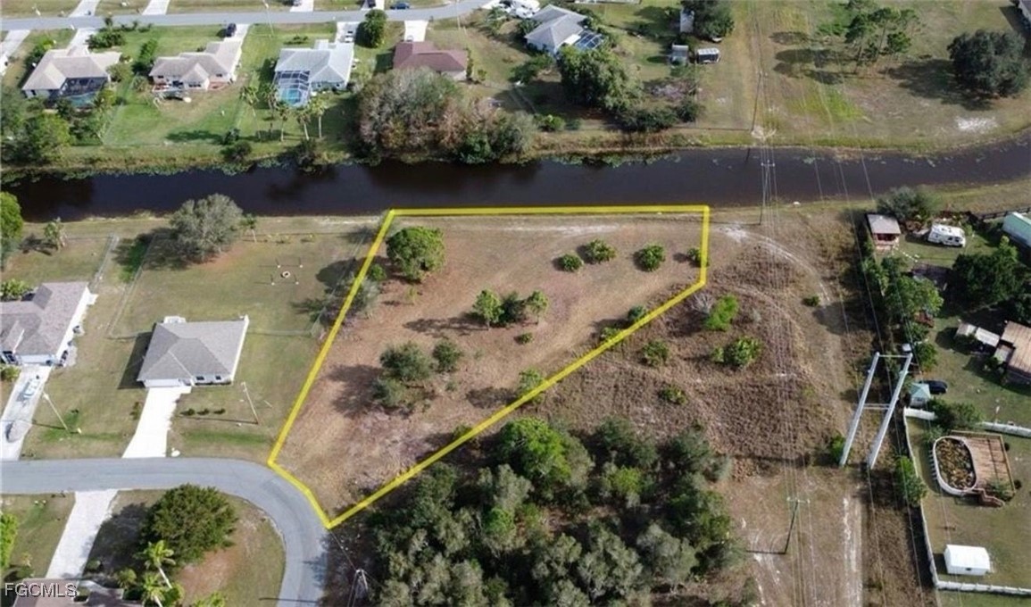 145 Zenith Circle Fort Myers, FL 33913 - Photo 6 of 9 an aerial view of a house with a lake view