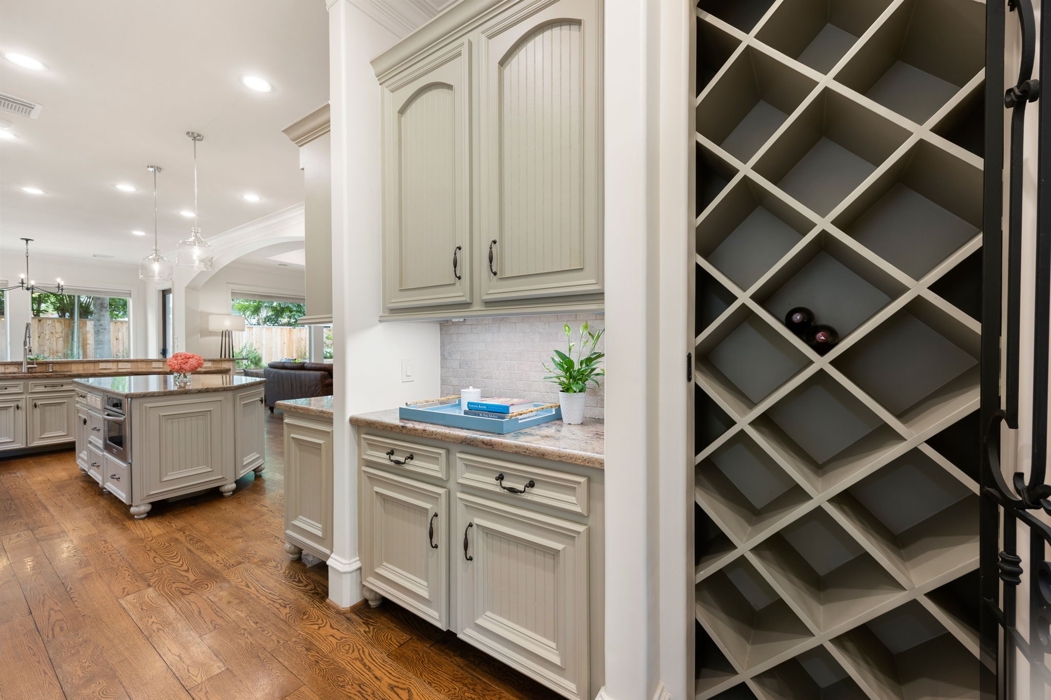 13310 Apple Tree Road Houston, TX 77079 - Photo 36 of 50 Between the Dining room and the kitchen is a built-in wine rack with an iron enclosure.
