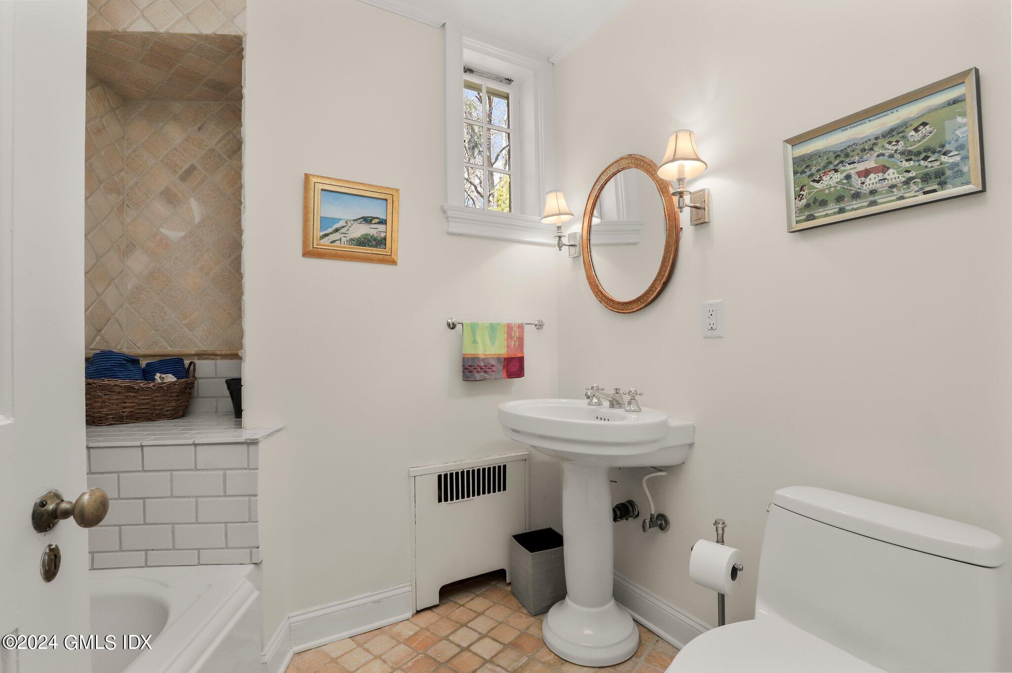 174 Cat Rock Road Cos Cob, CT 06807 - Photo 20 of 45 a bathroom with a sink mirror and toilet