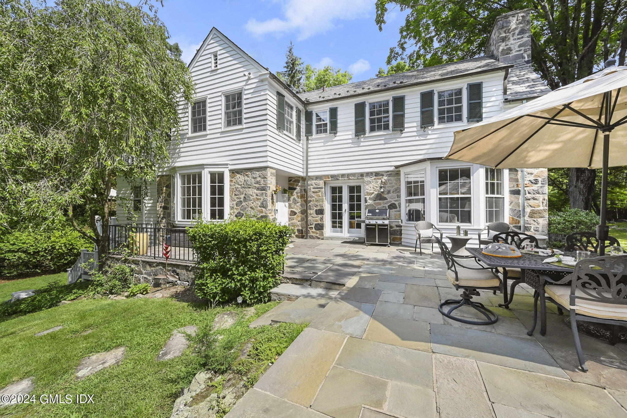 174 Cat Rock Road Cos Cob, CT 06807 - Photo 32 of 45 a view of a house with patio