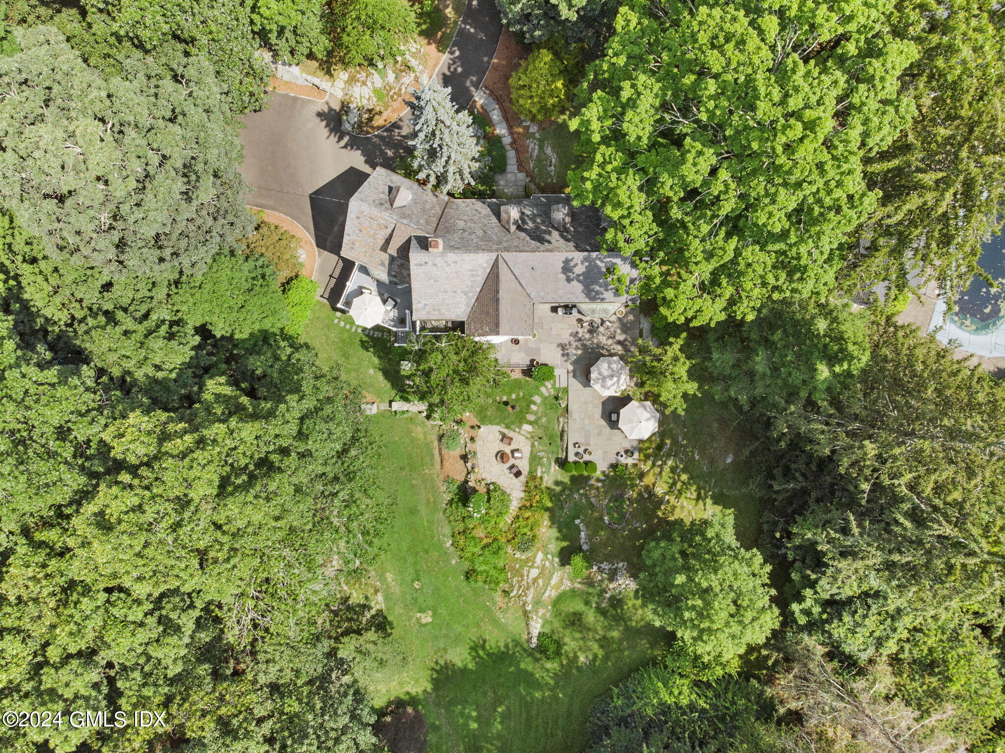 174 Cat Rock Road Cos Cob, CT 06807 - Photo 36 of 45 an aerial view of a house with a yard