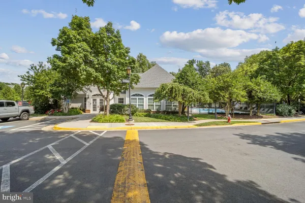 a view of a swimming pool with an outdoor space and seating area