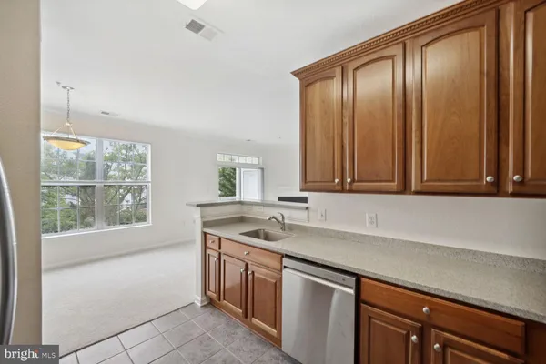 a kitchen with a sink and a window