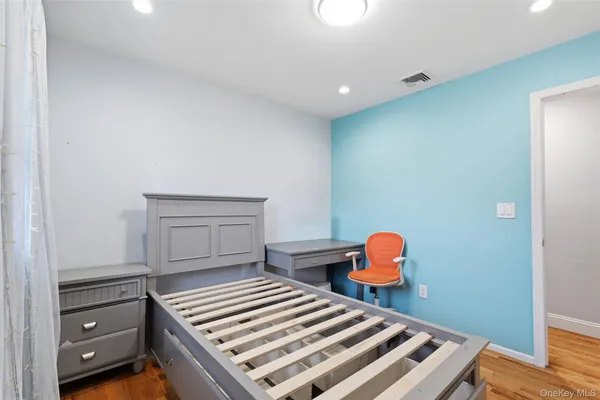 a bedroom with a bunk bed and a dresser