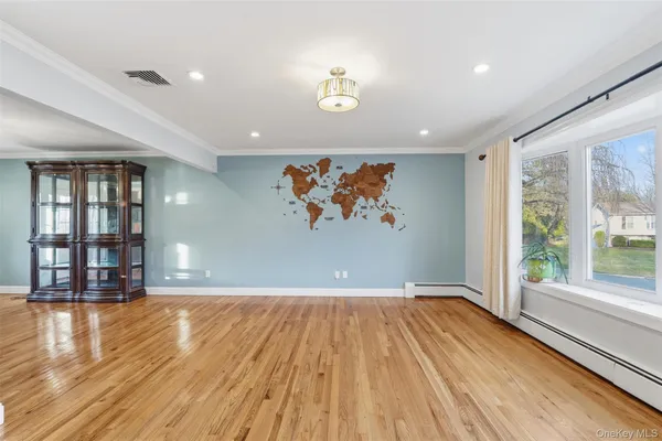 wooden floor in a hall with an entryway
