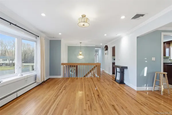 a view of a room with wooden floor and outdoor space