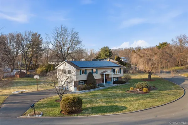 a view of a house with a yard
