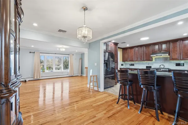 a view of kitchen and dining room with wooden floor