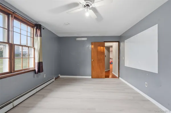 a view of an empty room with a window