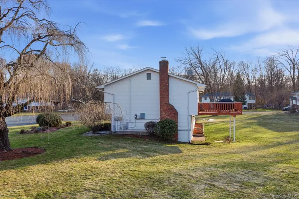 a view of a house with a backyard