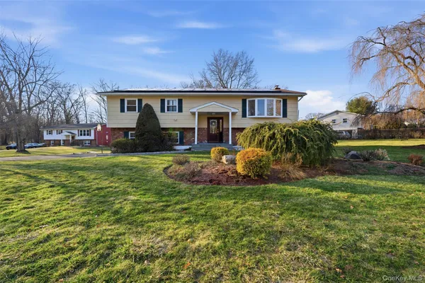 front view of a house with a yard
