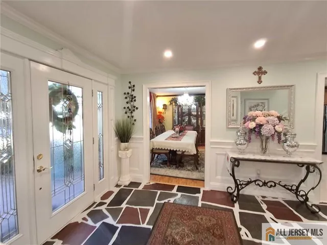 a room with furniture and view of living room