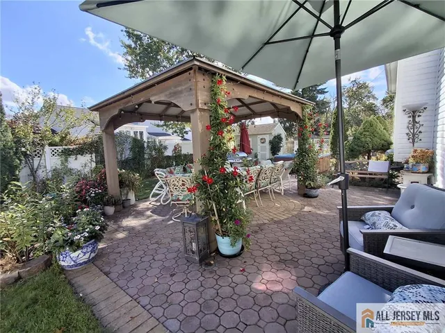 a view of a chairs and table in the patio