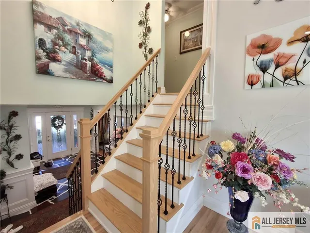 a view of entryway with a flower pot and a chandelier