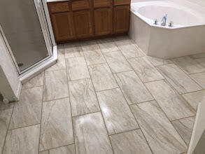 6014 Adams Street Jupiter, FL 33458 - Photo 6 of 15 a view of a bathtub in a bathroom