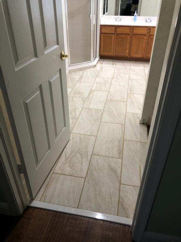 6014 Adams Street Jupiter, FL 33458 - Photo 7 of 15 a view of an empty room with wooden floor and a window