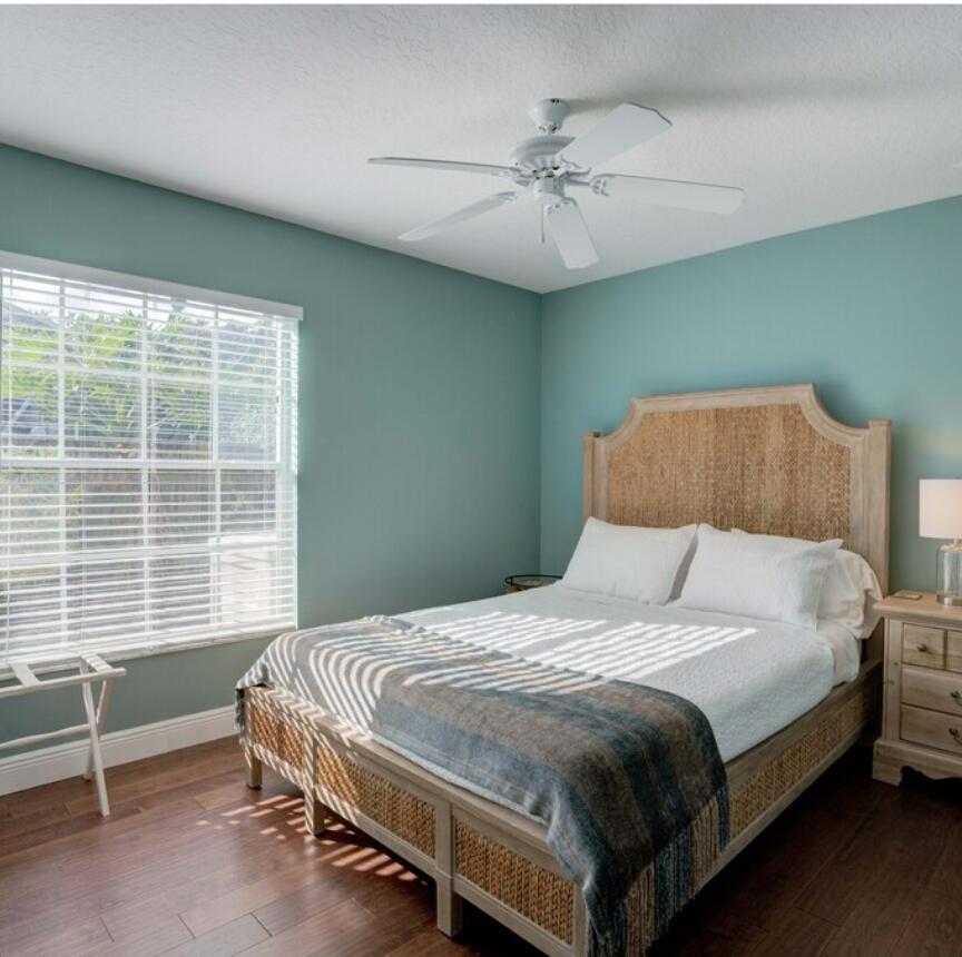6014 Adams Street Jupiter, FL 33458 - Photo 10 of 15 a bedroom with a bed and a window