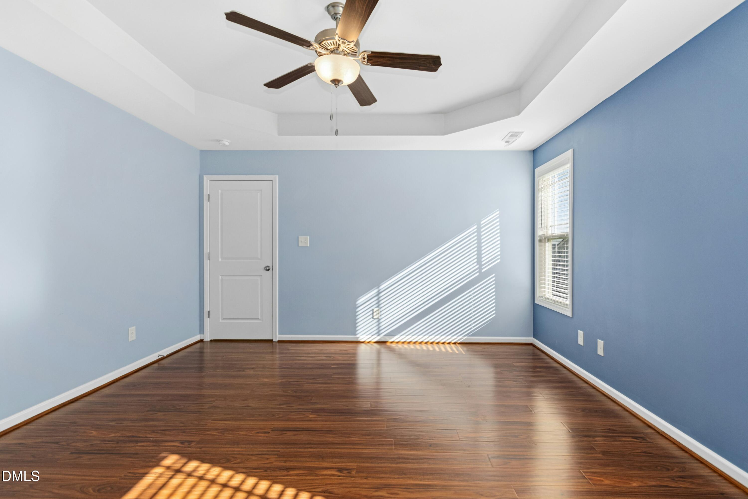48 Mountain View Drive Garner, NC 27529 - Photo 13 of 29 a view of empty room with wooden floor and fan