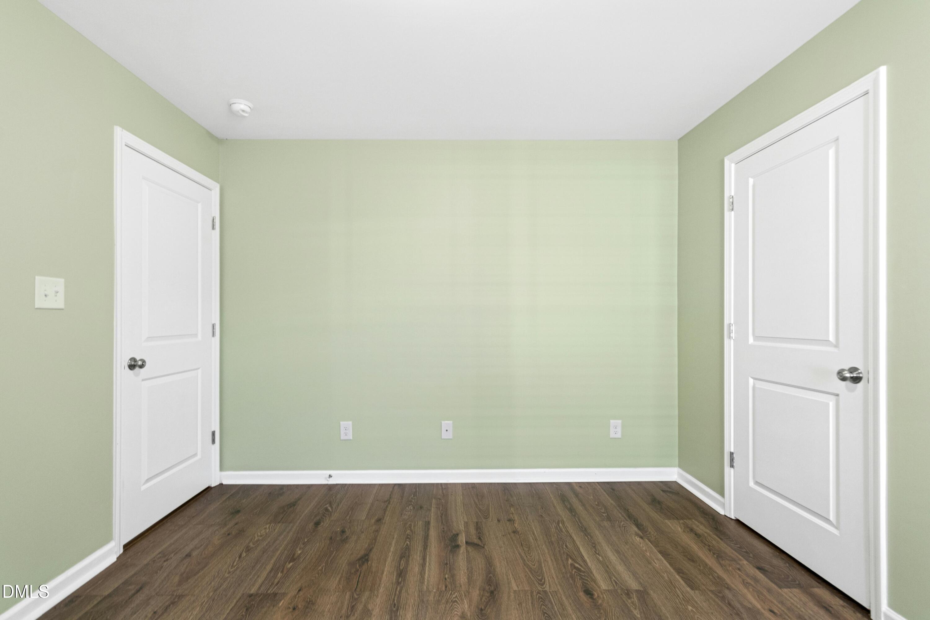 48 Mountain View Drive Garner, NC 27529 - Photo 19 of 29 an empty room with wooden floor and closet