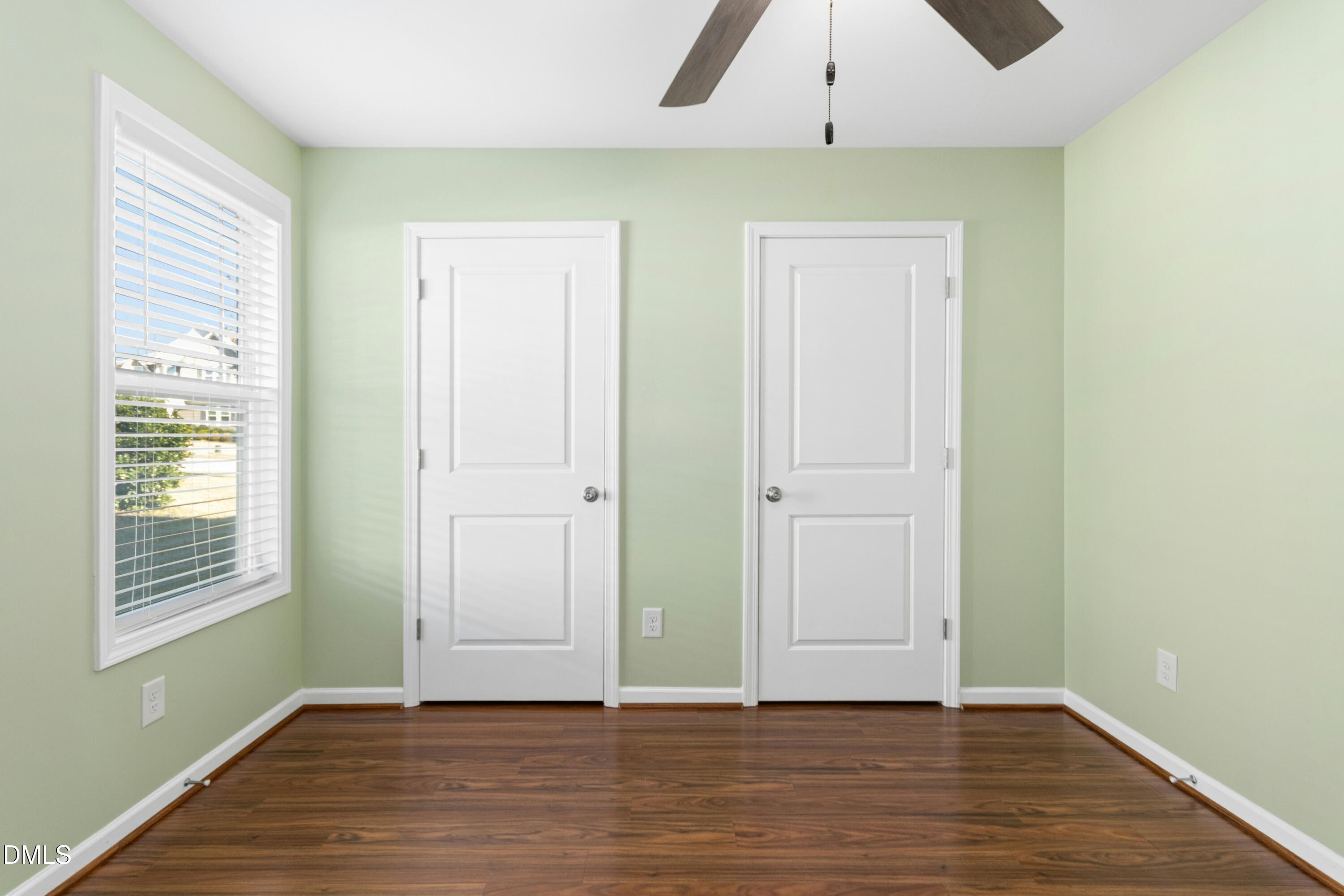 48 Mountain View Drive Garner, NC 27529 - Photo 21 of 29 a view of an empty room with wooden floor and a window