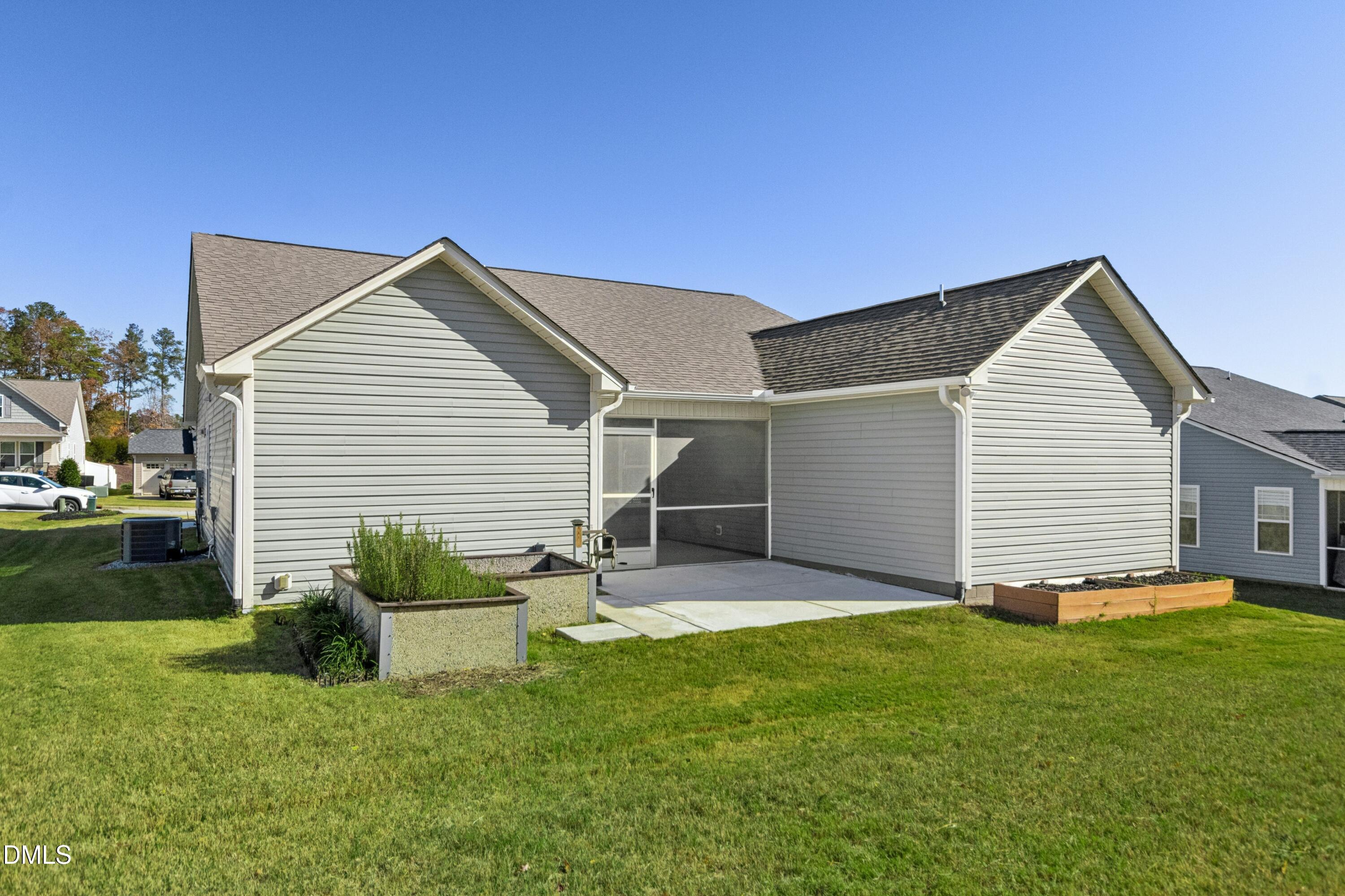 48 Mountain View Drive Garner, NC 27529 - Photo 27 of 29 a backyard of a house with table and chairs