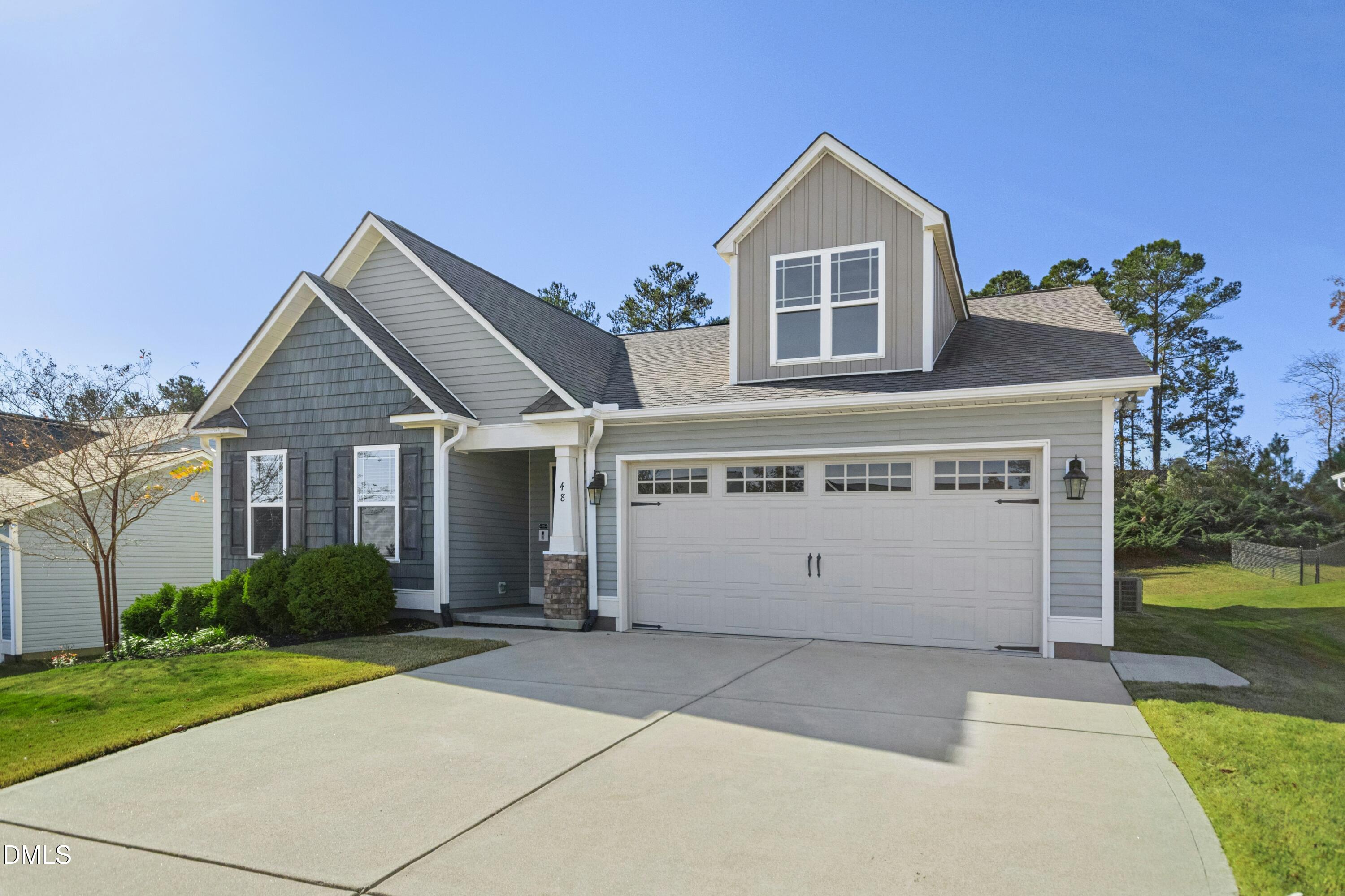 48 Mountain View Drive Garner, NC 27529 - Photo 28 of 29 a front view of a house with a yard and garage
