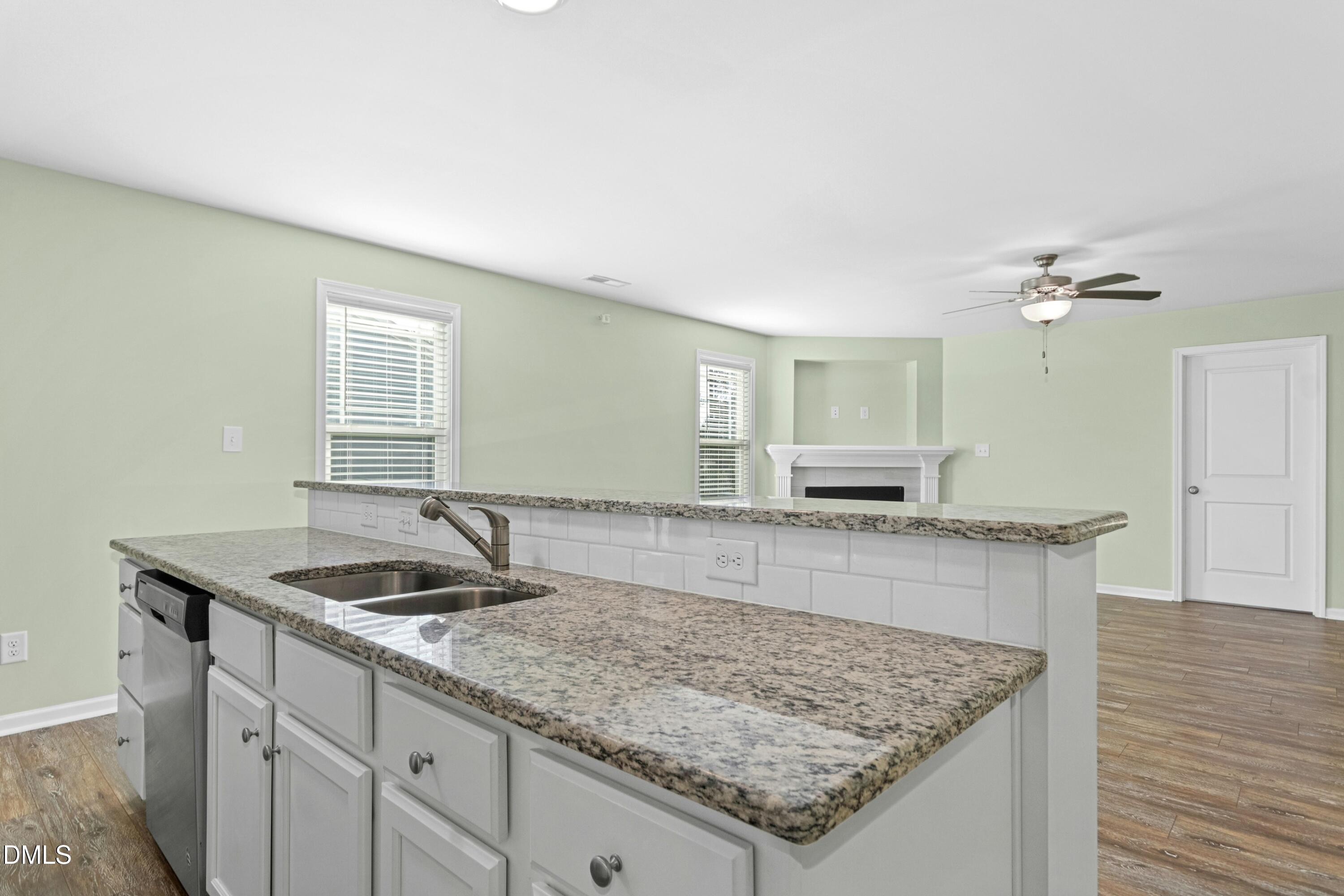 48 Mountain View Drive Garner, NC 27529 - Photo 8 of 29 a kitchen with a sink and wooden floor