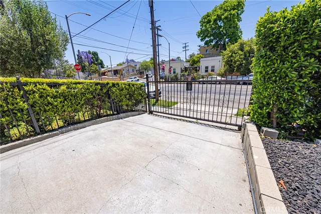 a view of a cars park in front of building