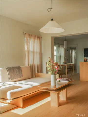 a view of a living room and chandelier