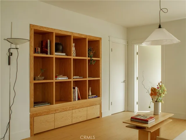 a view of a workspace with furniture and cabinet