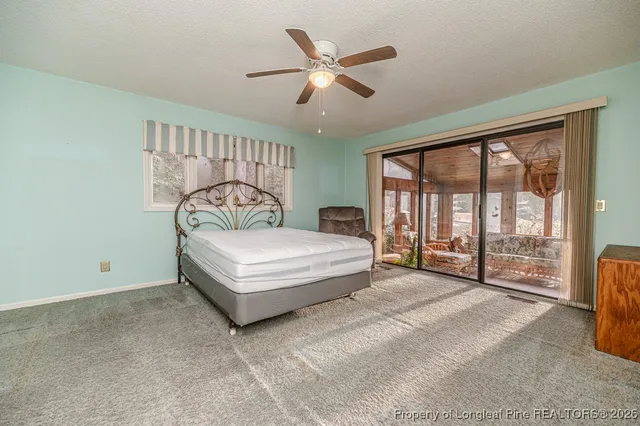 a bathroom with a granite countertop sink mirror and shower