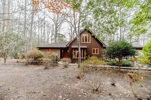a house with trees in the background