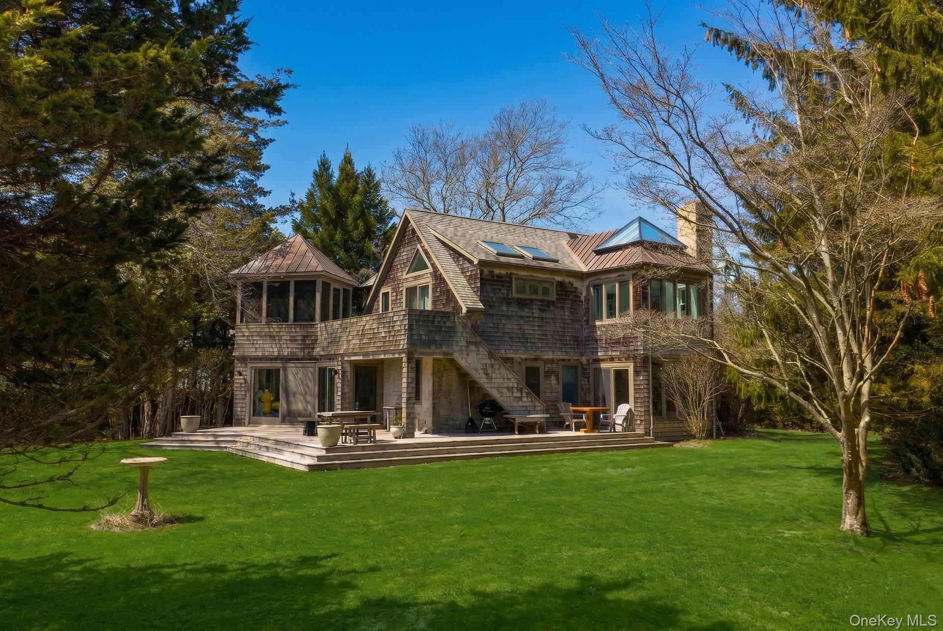60 Skimhampton Road East Hampton, NY 11937 - Photo 32 of 37 a front view of a house with garden