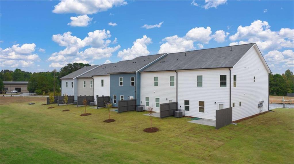 1057 Merritt Drive, Unit 83 Villa Rica, GA 30180 - Photo 2 of 49 a view of a house with backyard and sitting area