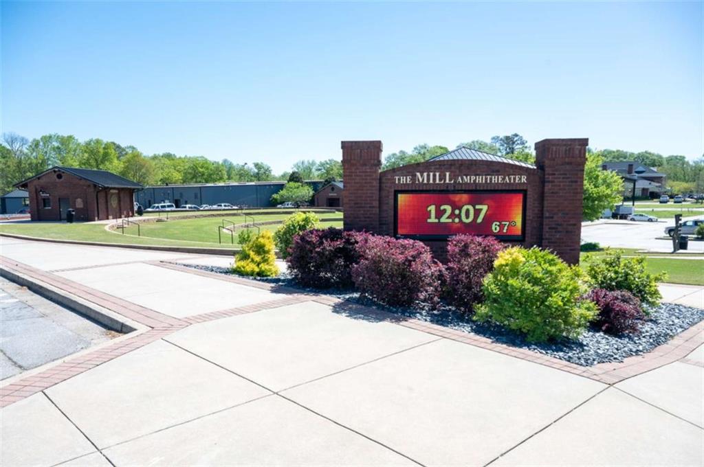 1057 Merritt Drive, Unit 83 Villa Rica, GA 30180 - Photo 49 of 49 a sign board with a house and a street view