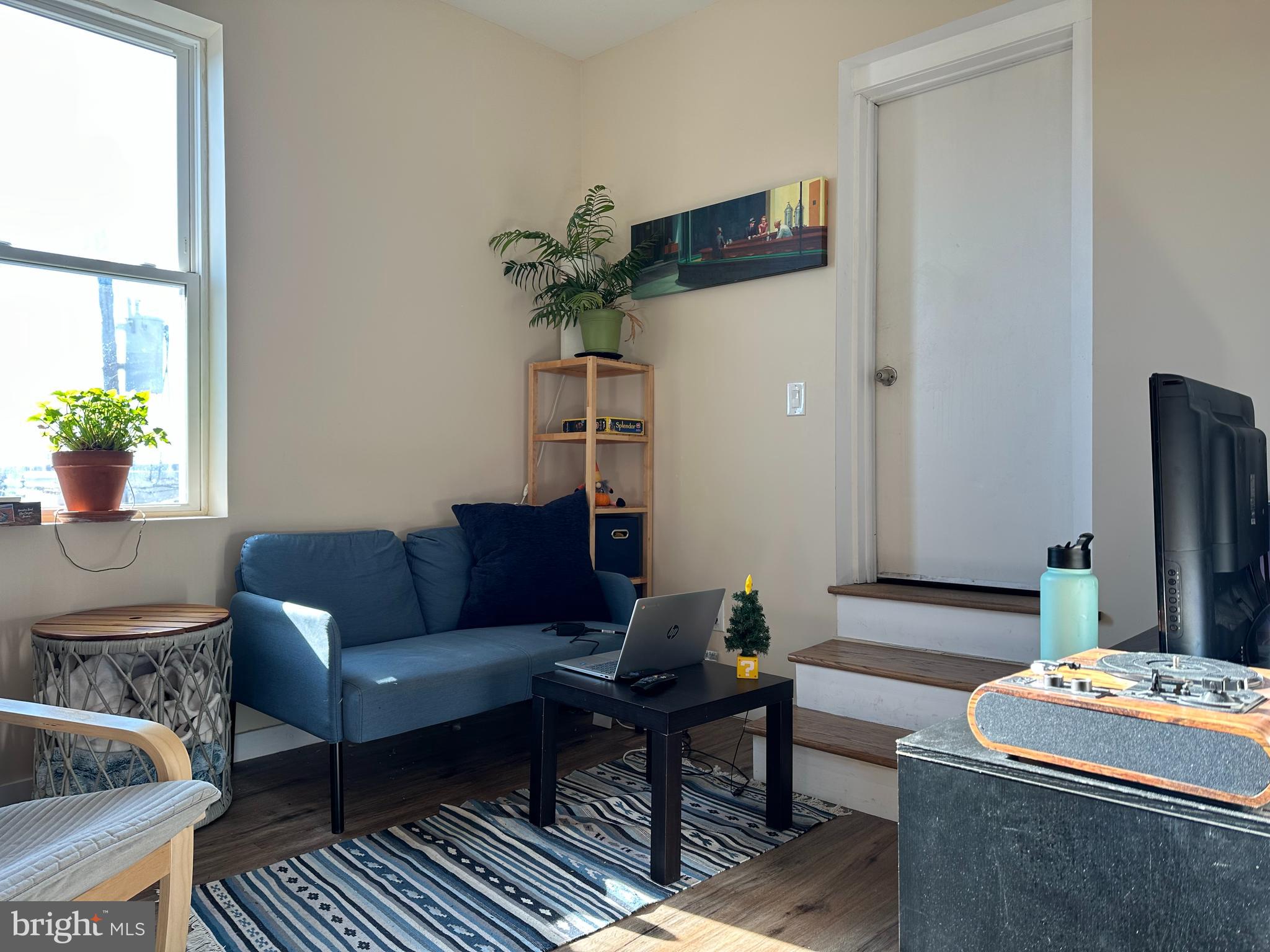 1648 South 16th Street, Unit 2 Philadelphia, PA 19145 - Photo 2 of 10 a living room with furniture and a potted plant
