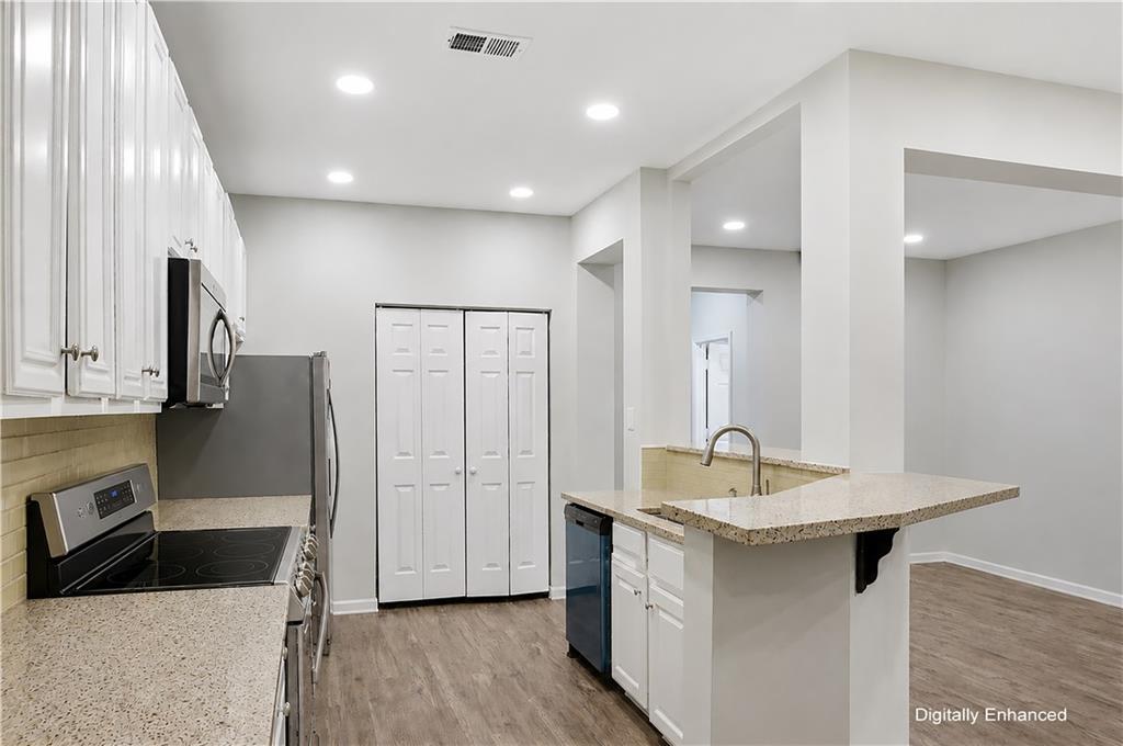 2555 Flat Shoals Road, Unit 2008 Atlanta, GA 30349 - Photo 10 of 33 a kitchen with a sink cabinets and refrigerator