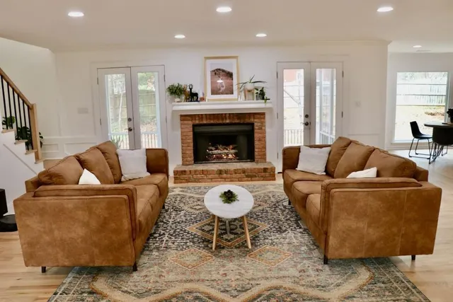 a living room with furniture and a fireplace
