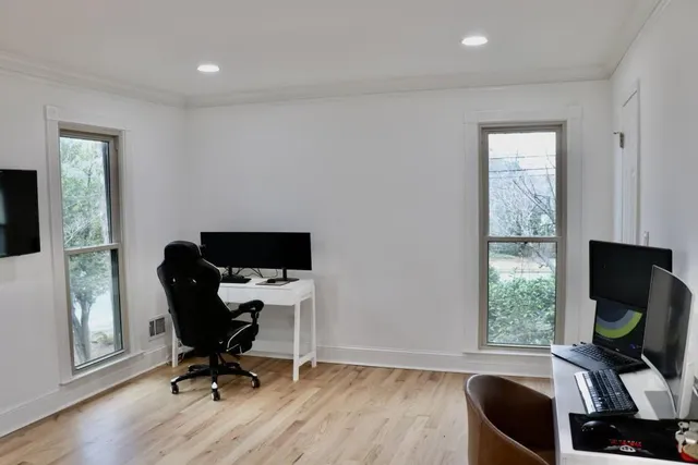 a view of workspace with wooden floor lounge chair