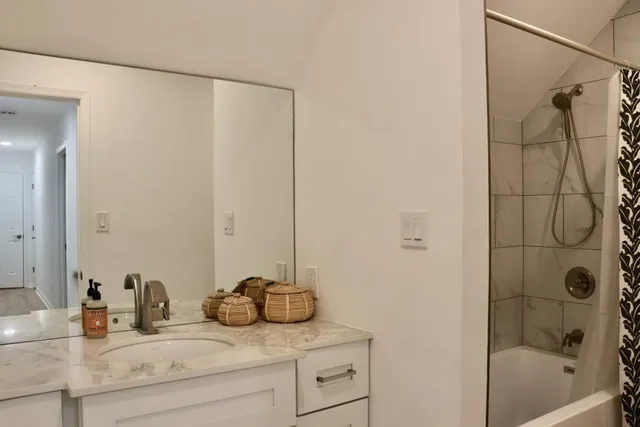 a bathroom with a sink and a shower