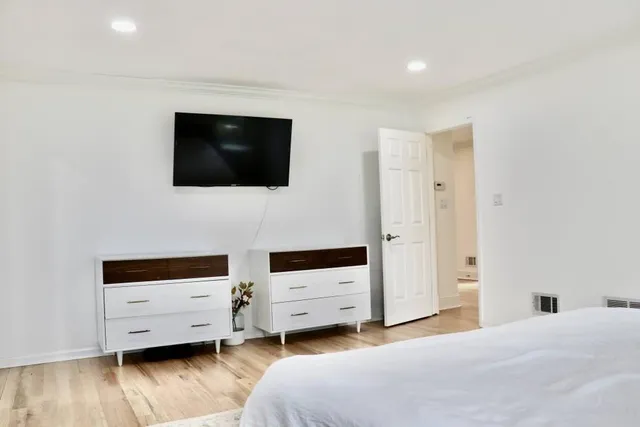 a view of a yard covered with snow in front of house