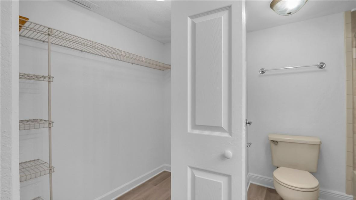 5681 Riverside Drive, Unit 101A6 Coral Springs, FL 33067 - Photo 15 of 25 a bathroom with a toilet and a shower