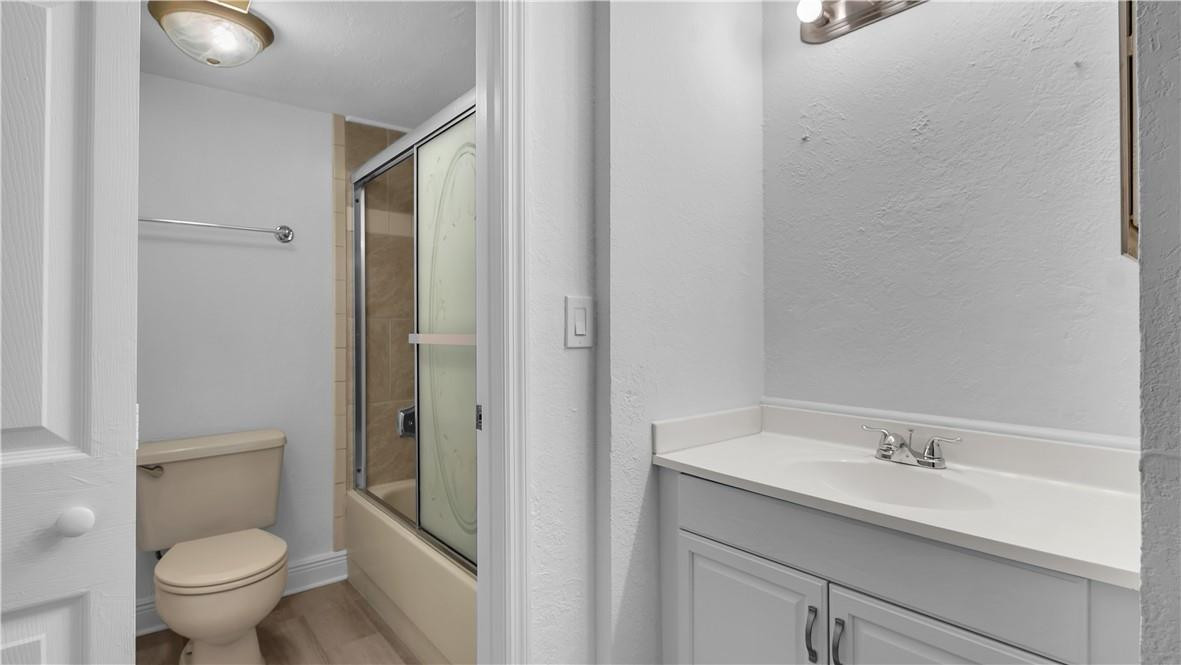 5681 Riverside Drive, Unit 101A6 Coral Springs, FL 33067 - Photo 16 of 25 a bathroom with a sink and a toilet