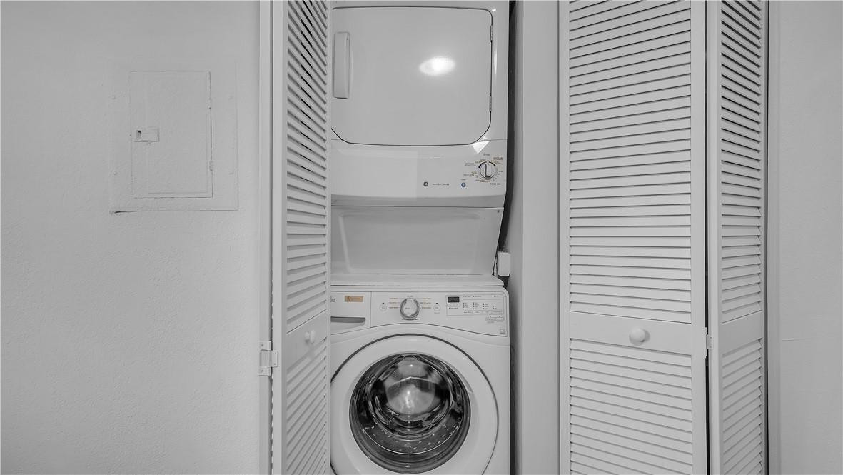 5681 Riverside Drive, Unit 101A6 Coral Springs, FL 33067 - Photo 20 of 25 a view of a hallway with washer and dryer