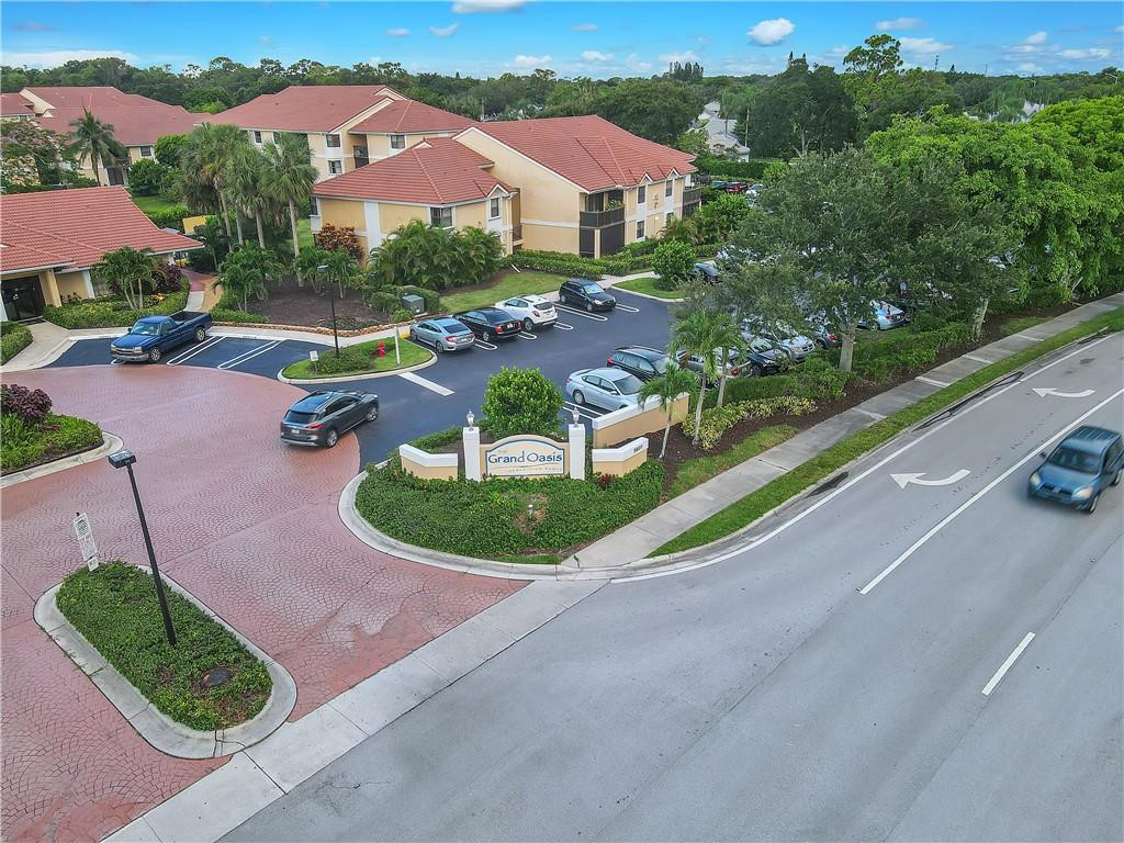 5681 Riverside Drive, Unit 101A6 Coral Springs, FL 33067 - Photo 23 of 25 an aerial view of a house with a garden and mountains