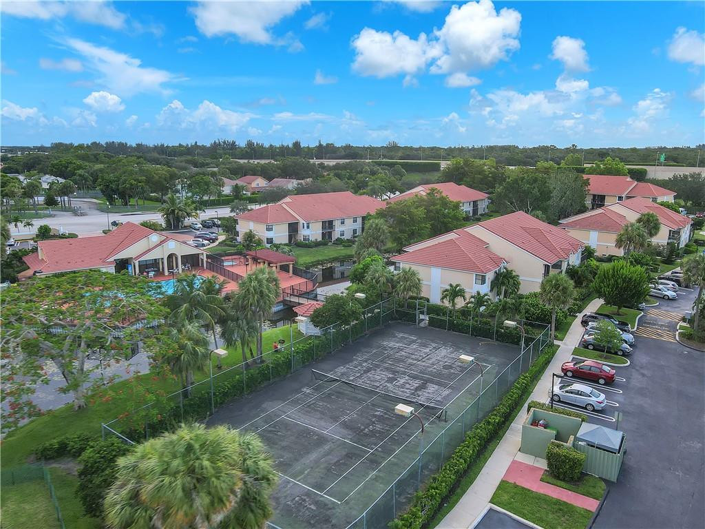 5681 Riverside Drive, Unit 101A6 Coral Springs, FL 33067 - Photo 24 of 25 a view of a city street view and lake view